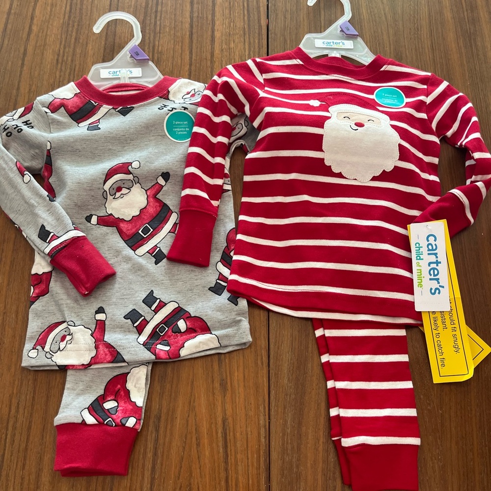 Pair of Carter’s Christmas pajama sets